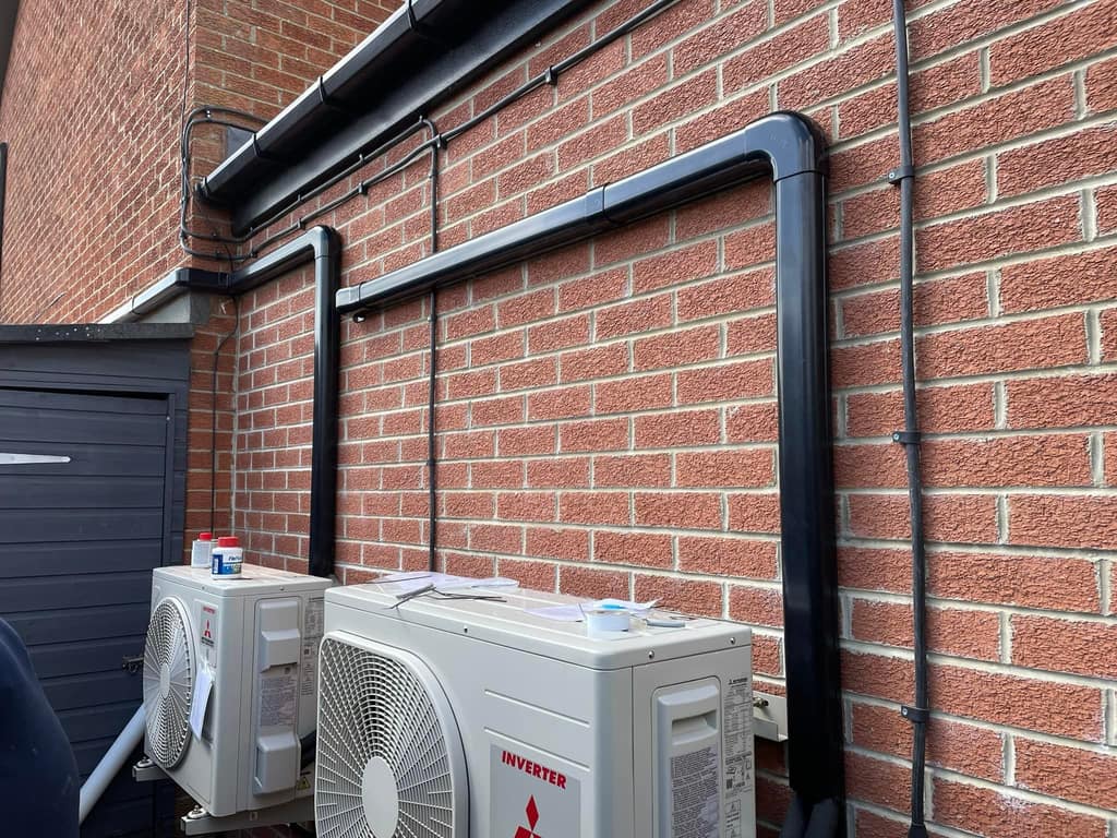 Air conditioning outdoor units on a brick wall, Manchester Air conditioning outdoor units on a brick wall fitted by UK Aircon, air conditioning installers serving Manchester