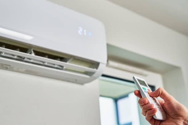 Wall-mounted air conditioner and remote control, Newcastle Wall-mounted air conditioner and remote control, air conditioning for homes and businesses in Newcastle
